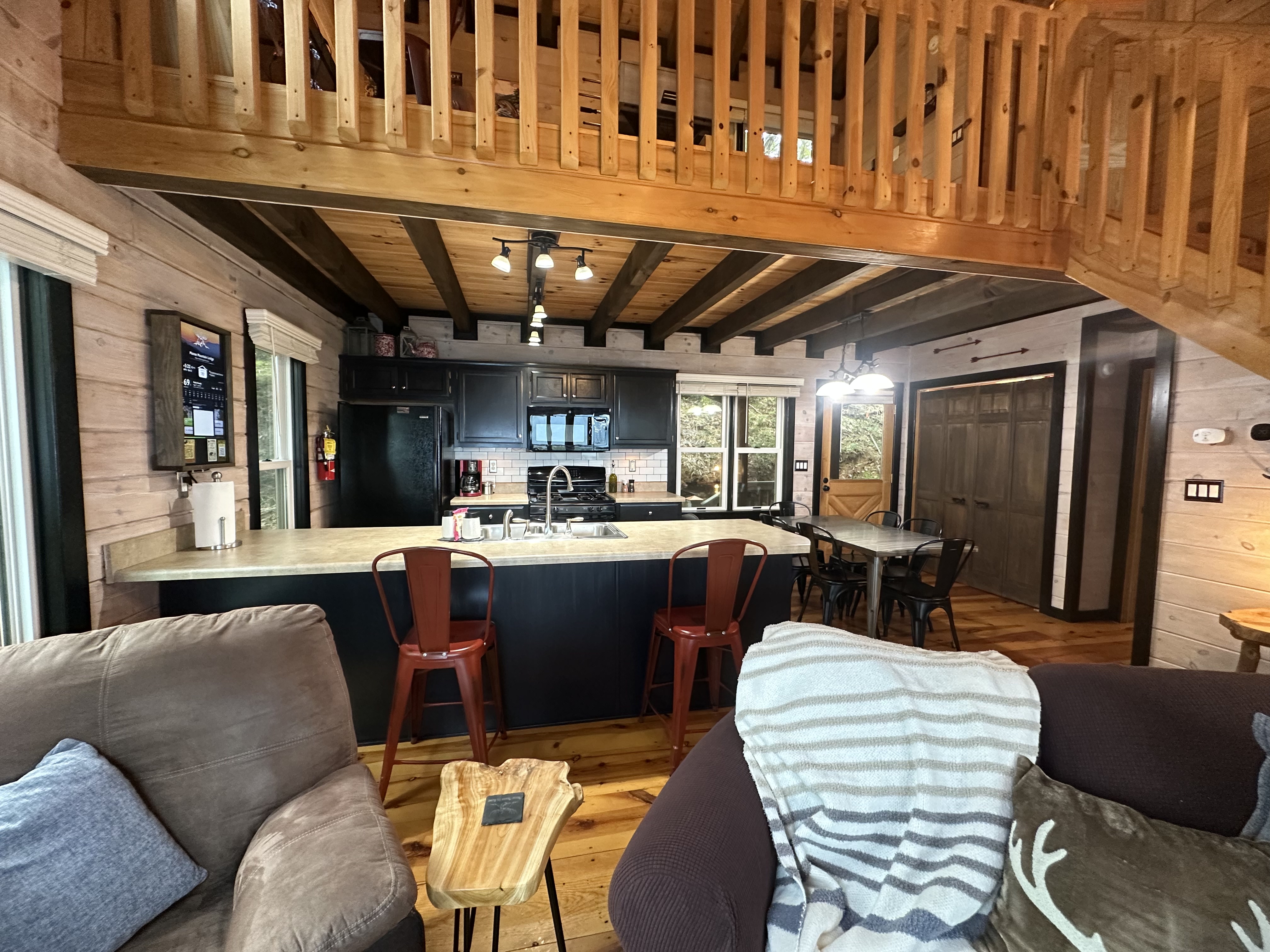 The kitchen island keeps snacks, coffee, and conversation right in the center of the cabin.